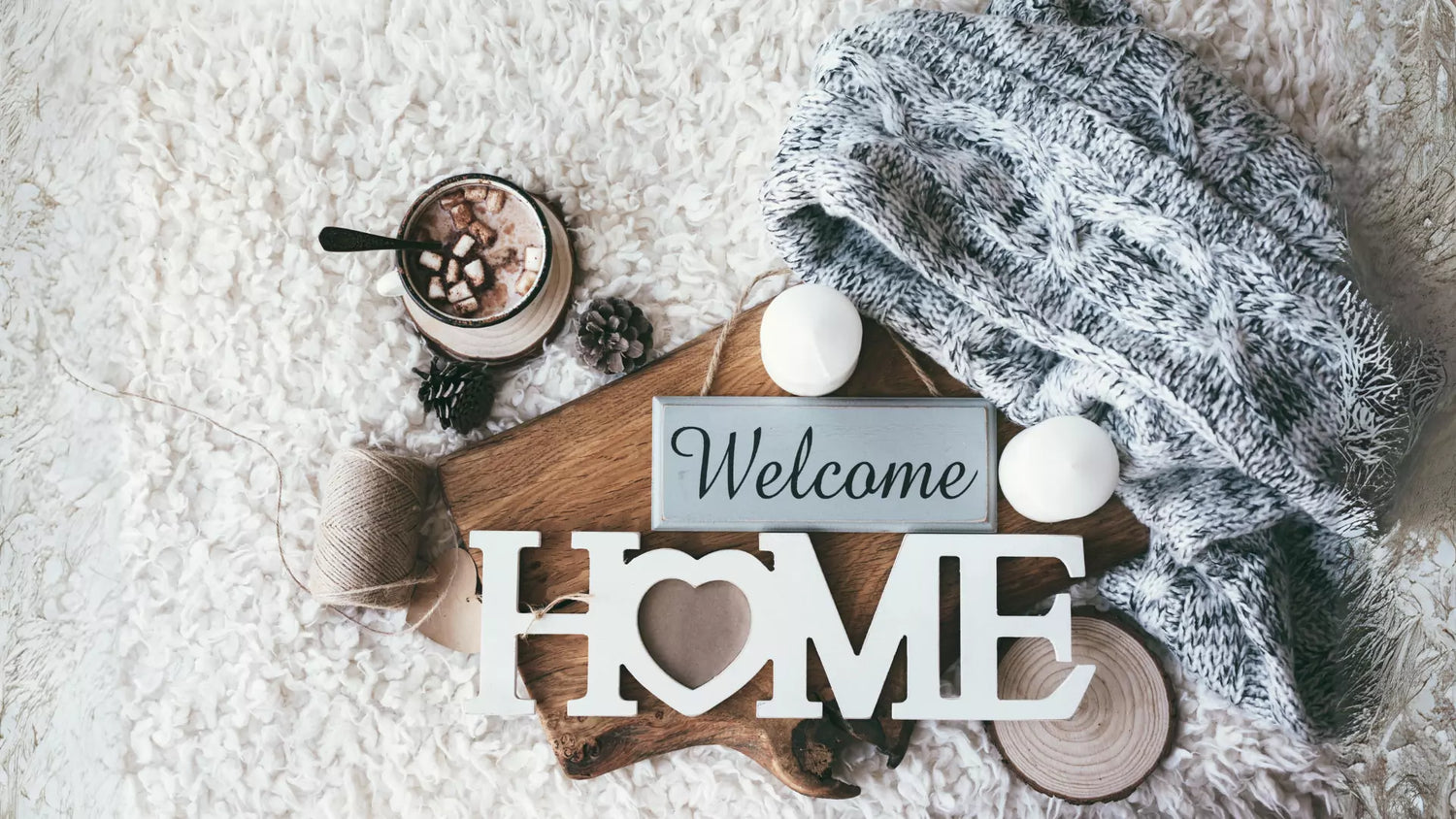 welcome home sign on a rug